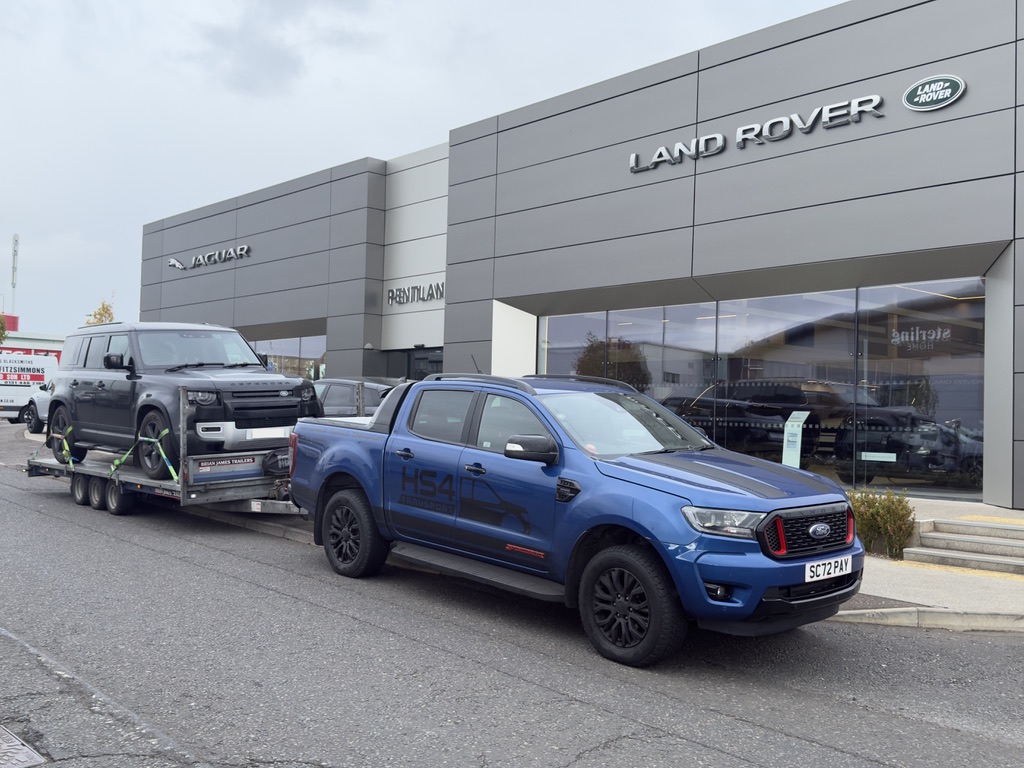 HS4 Transport at a Land Rover dealership collecting a Defender