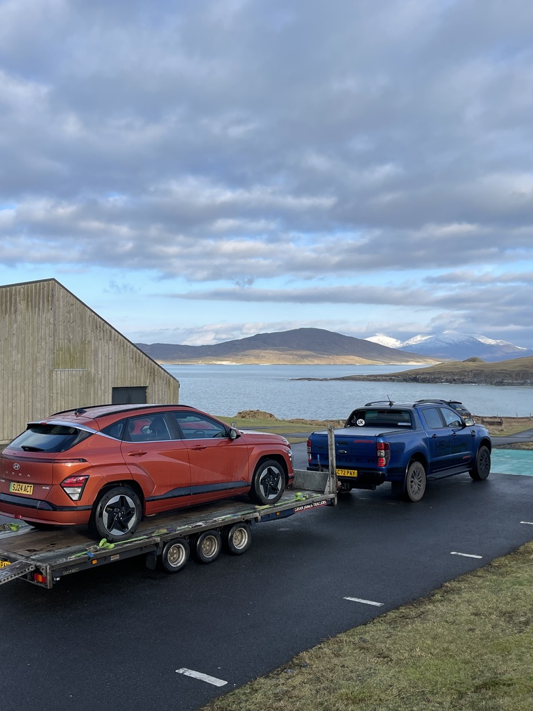 Vehicle transport beside the Western Isles coast