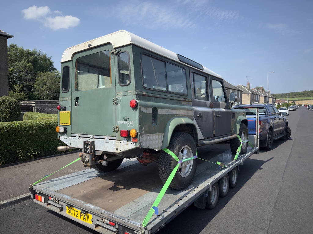 Series Land Rover loaded and strapped for transport